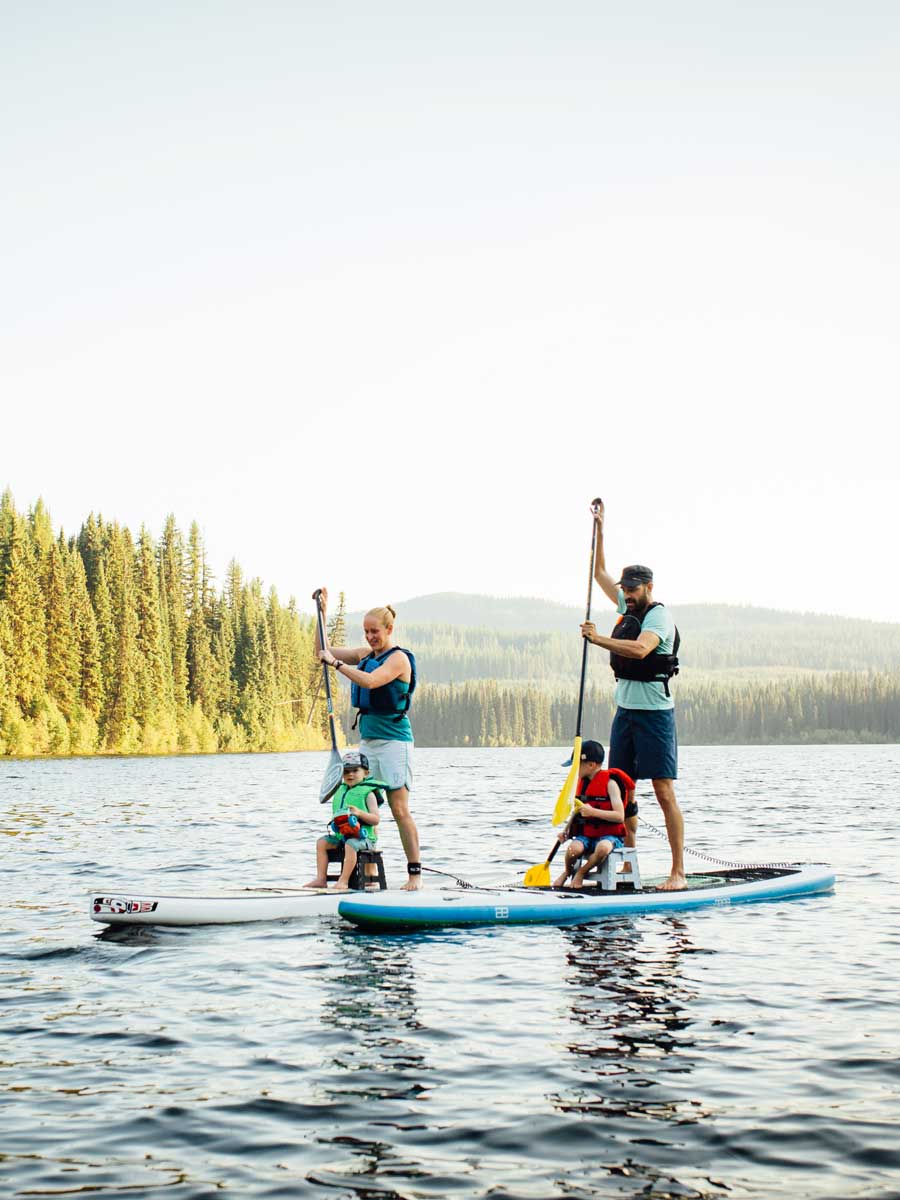 Family paddleboarding near Rossland, BC
