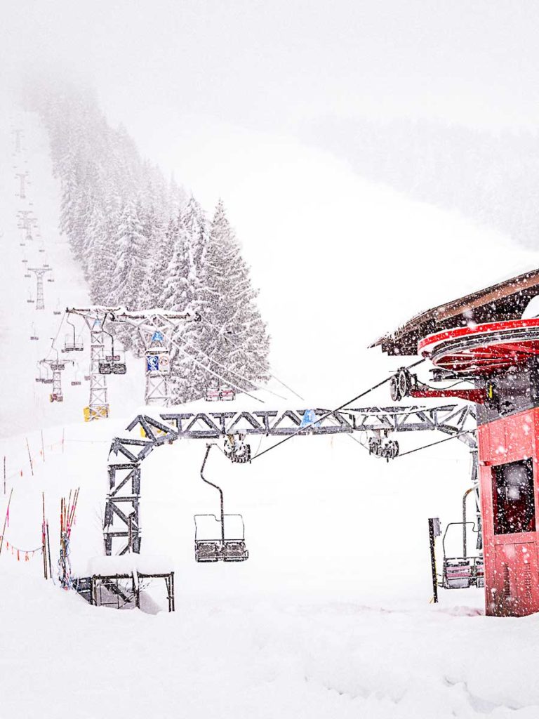 RED Mountain chair lift in the snow.