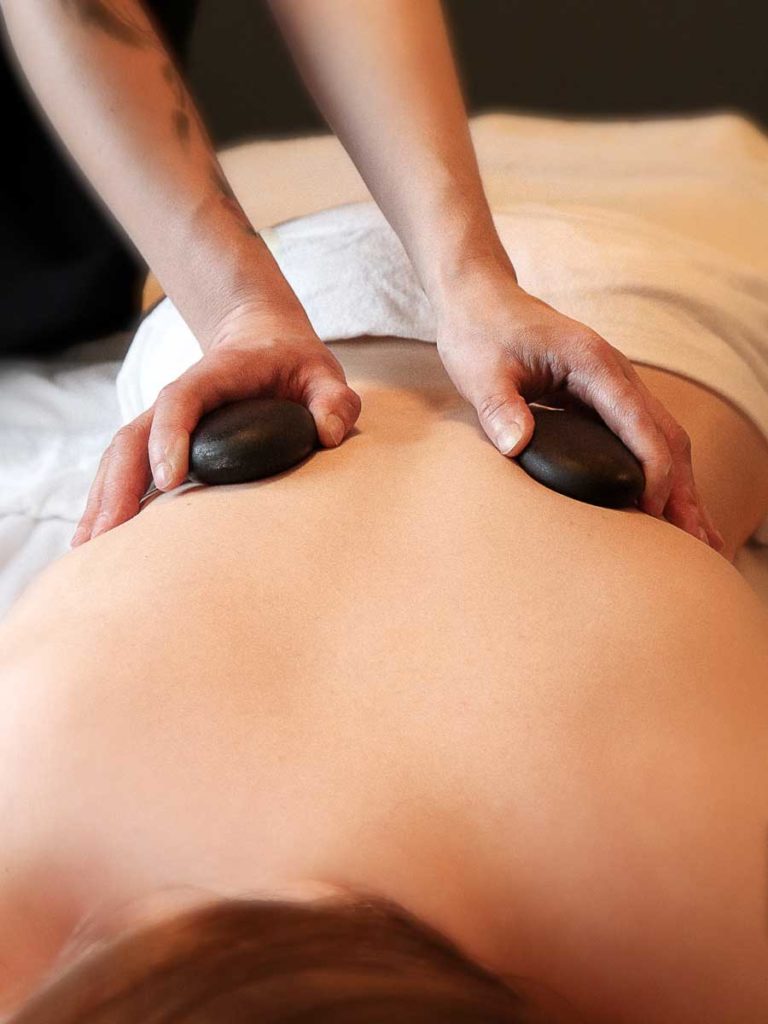 Person Getting A Hot Rock Massage.