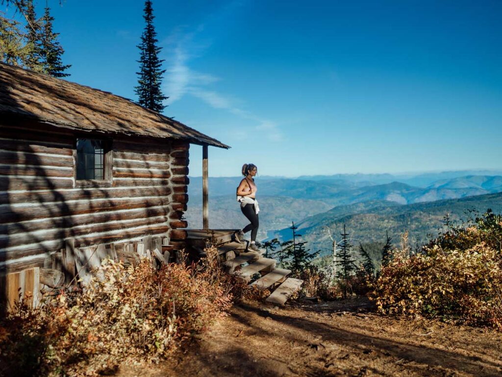Lady Coming Out Of A Cabin In Yoga Clothes.